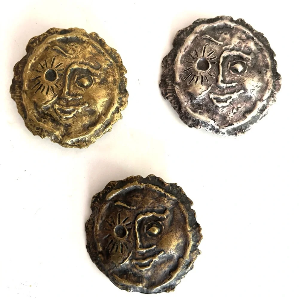 Three vintage belt buckles